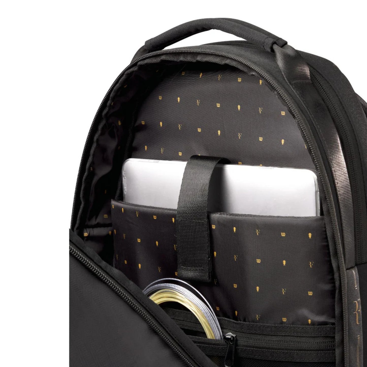 Black backpack with compartments containing a laptop and other items on a white background