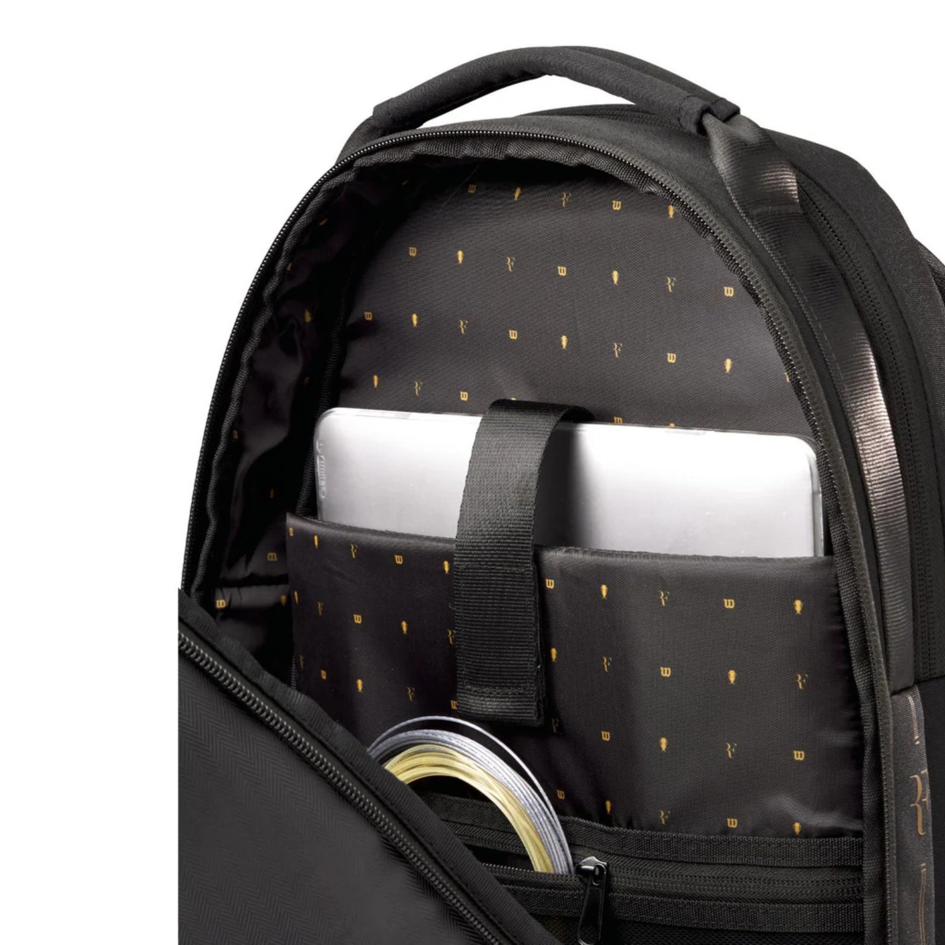 Black backpack with compartments containing a laptop and other items on a white background