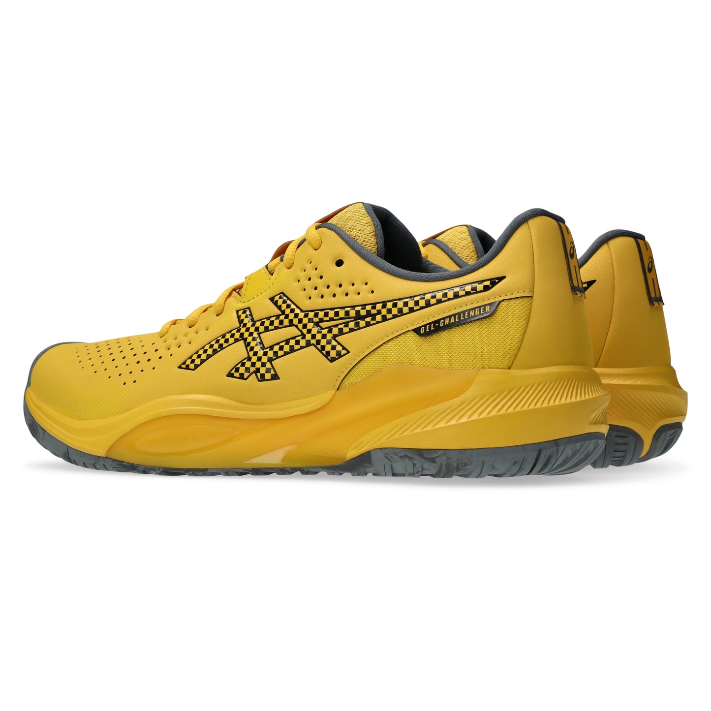 A pair of yellow Asics tennis shoes with black and yellow checkered details on the logo and side, shown against a plain white background.