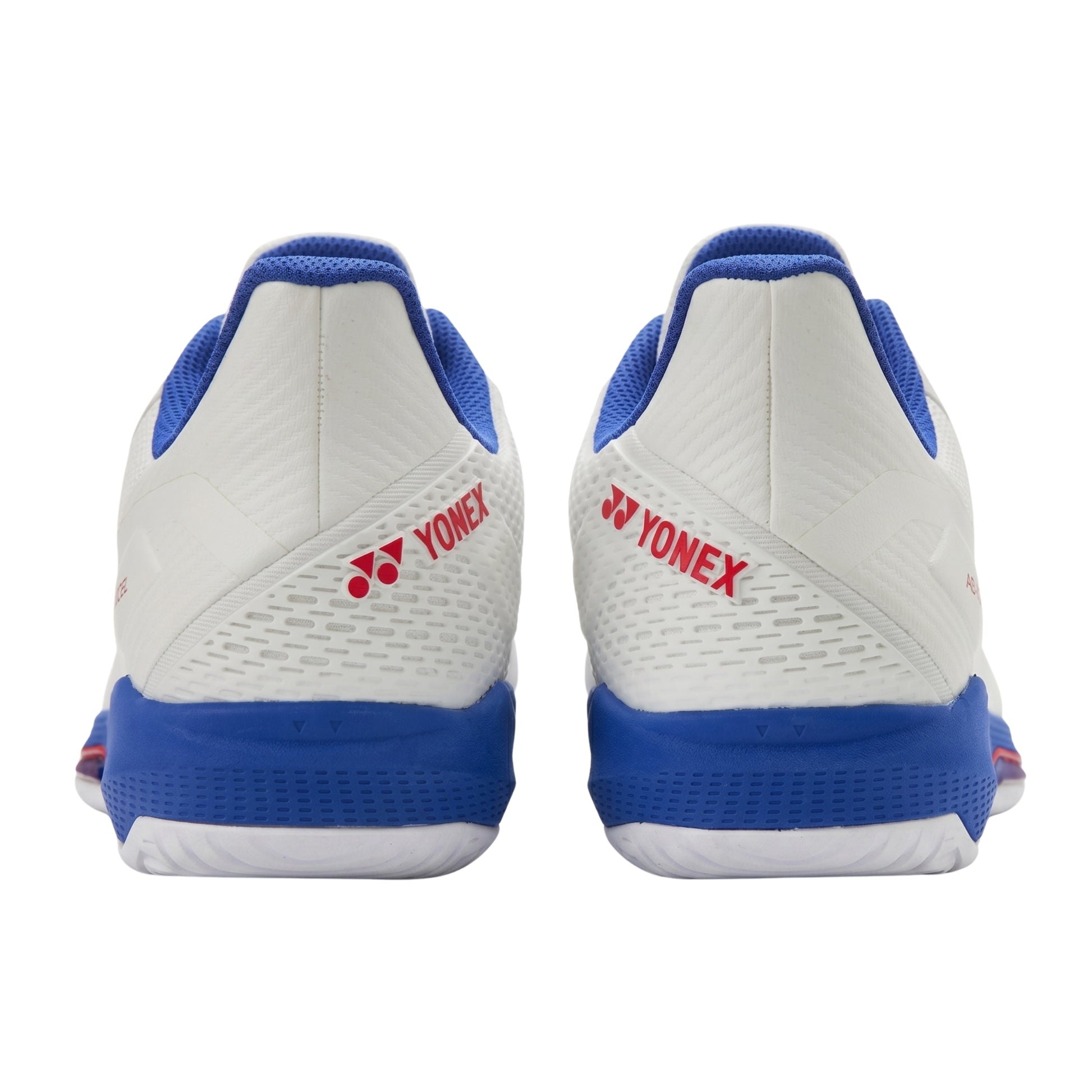 White and blue Yonex shoes with red logo on a white background