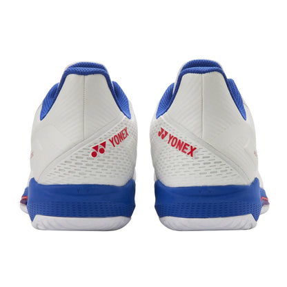 White and blue Yonex shoes with red logo on a white background