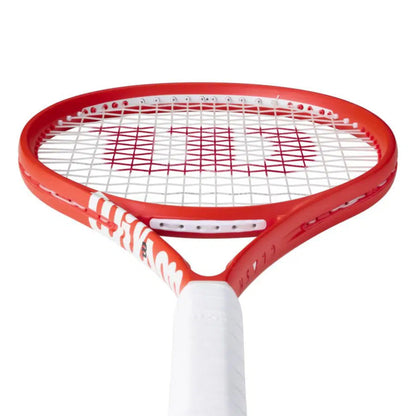 Red and white tennis racket on a white background
