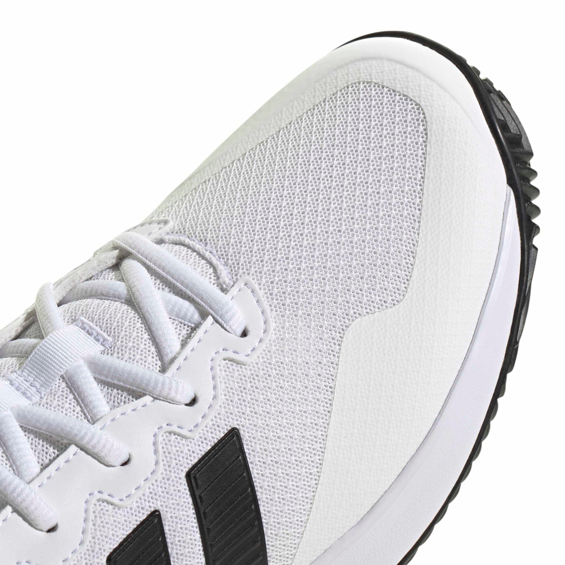 White tennis shoe with black accents on a white background