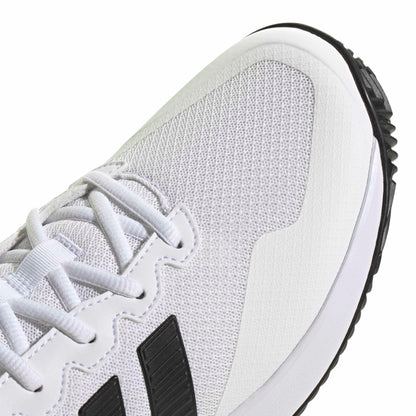 White tennis shoe with black accents on a white background