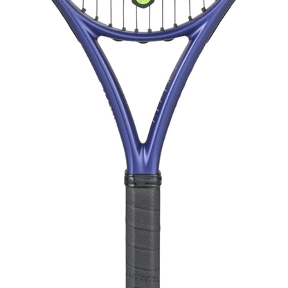 A close-up of a tennis racket showing the blue-purple frame and black grip against a plain white background.