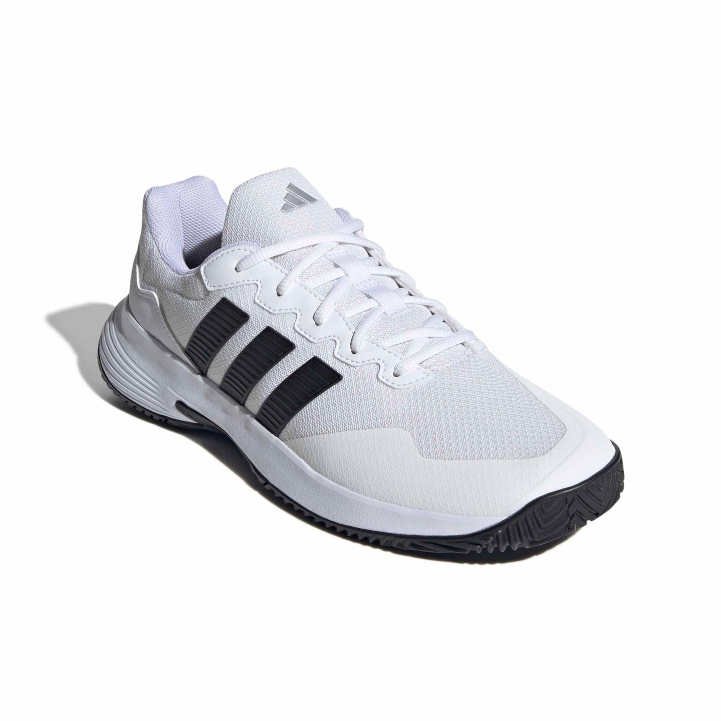 White tennis shoe with black stripes on a white background