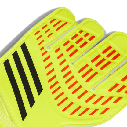 Close-up of a bright yellow sports glove with red and black patterns on a white background