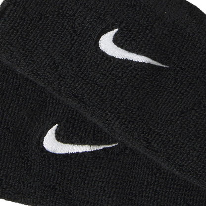 Two black wristbands with white Nike logos on a white background