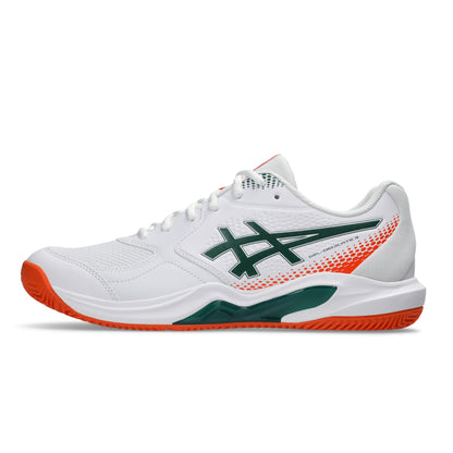A white Asics padel shoe with a green logo and orange accents on the heel and outsole, shown in a side profile on a white background.