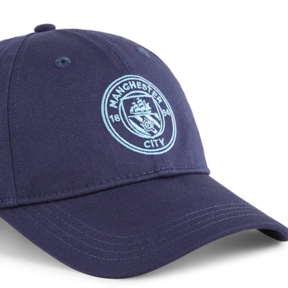 Navy blue cap with Manchester City logo on a white background