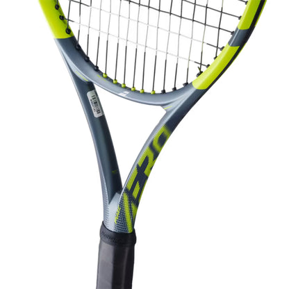 Tennis racket with a close-up of the strings on a white background