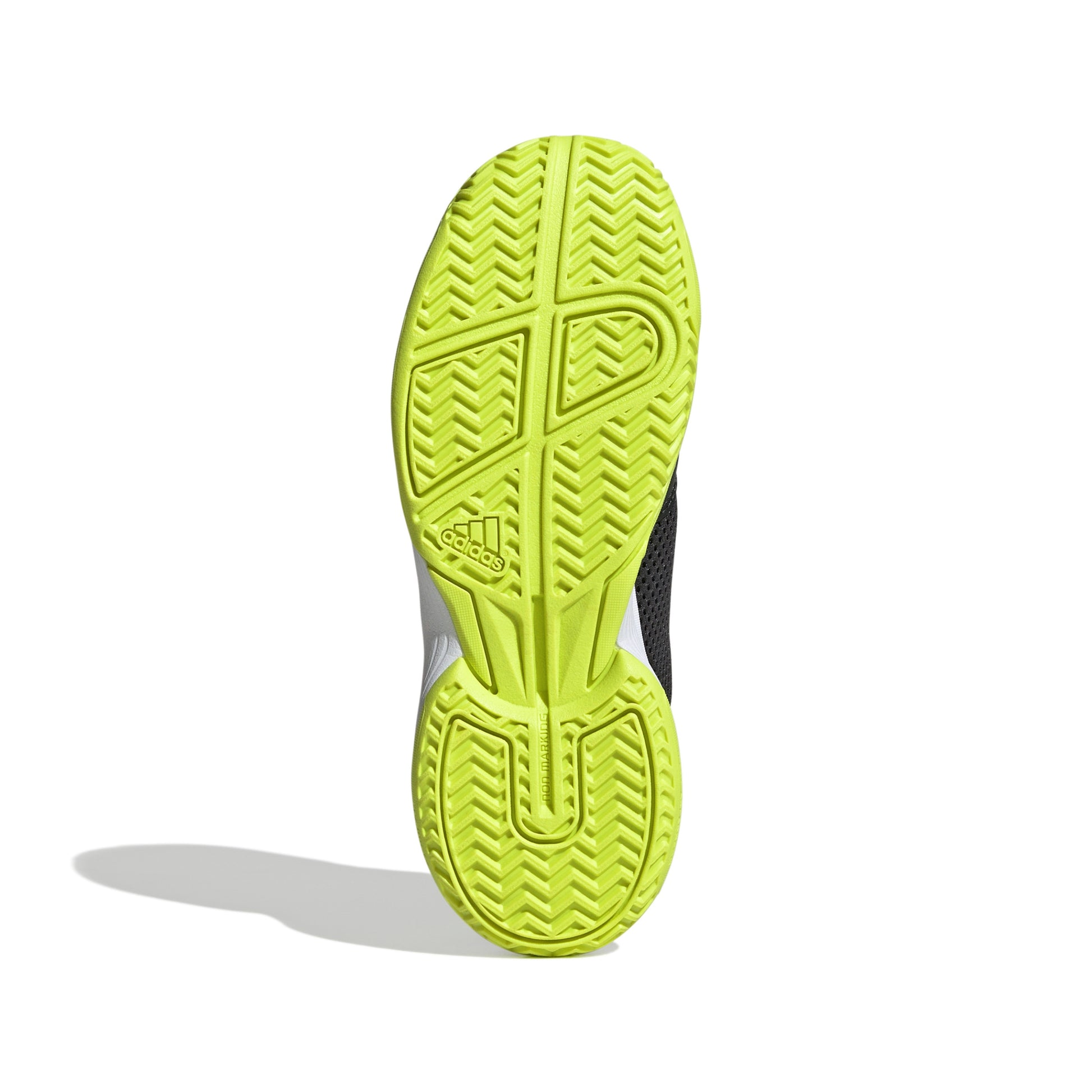 Close-up of a green Adidas tennis shoe sole with Adidas logo on a white background