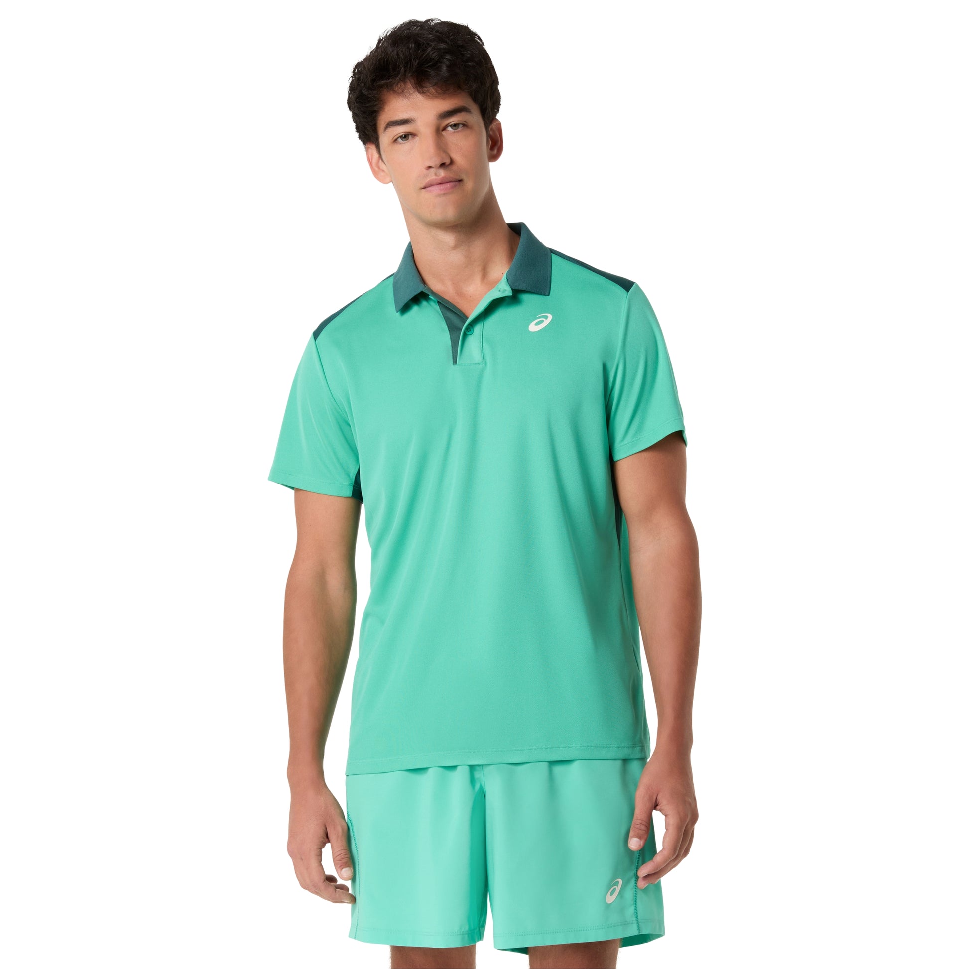 Man wearing a green athletic outfit with a brand logo on a white background