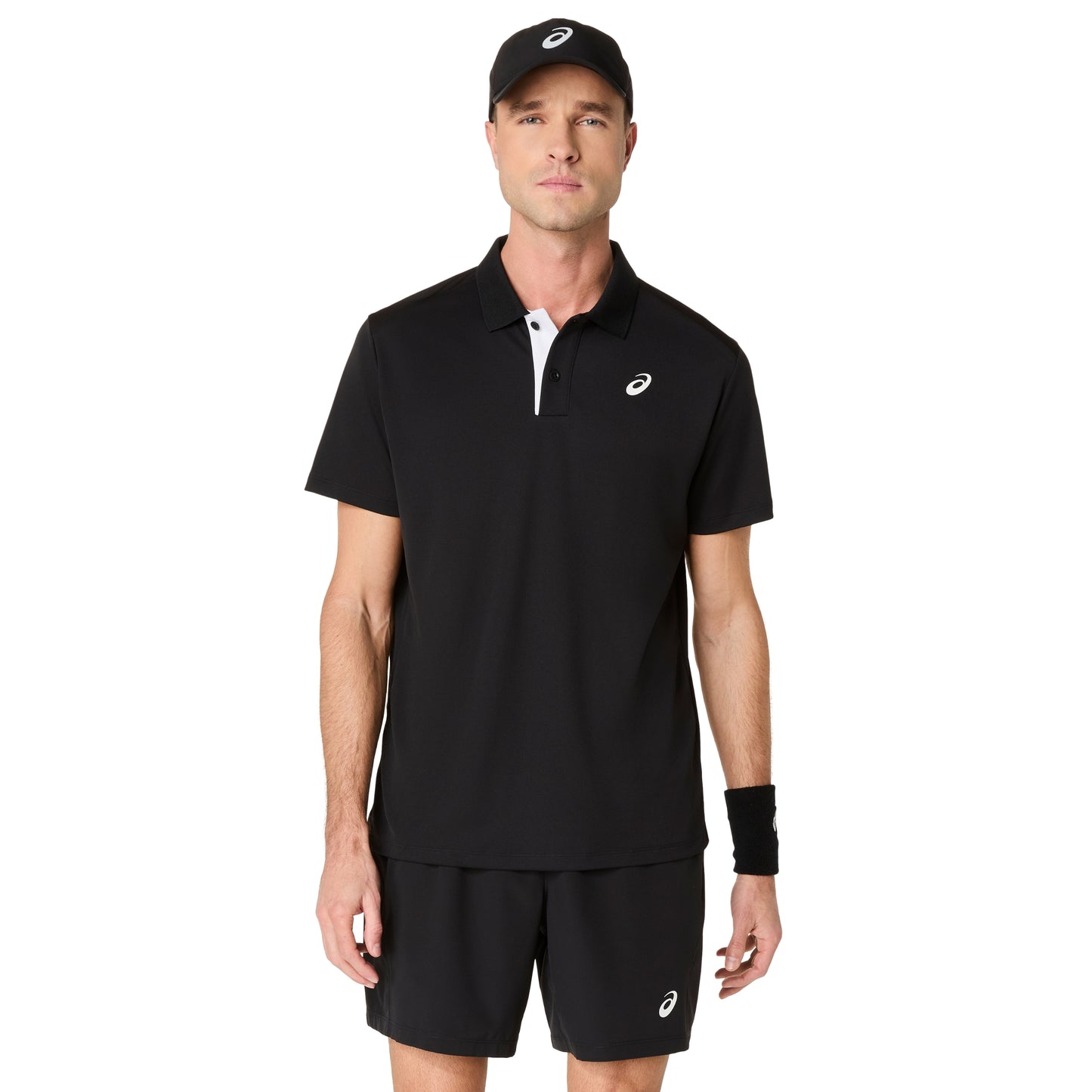 Man wearing a black polo shirt and shorts with a visible brand logo on a white background