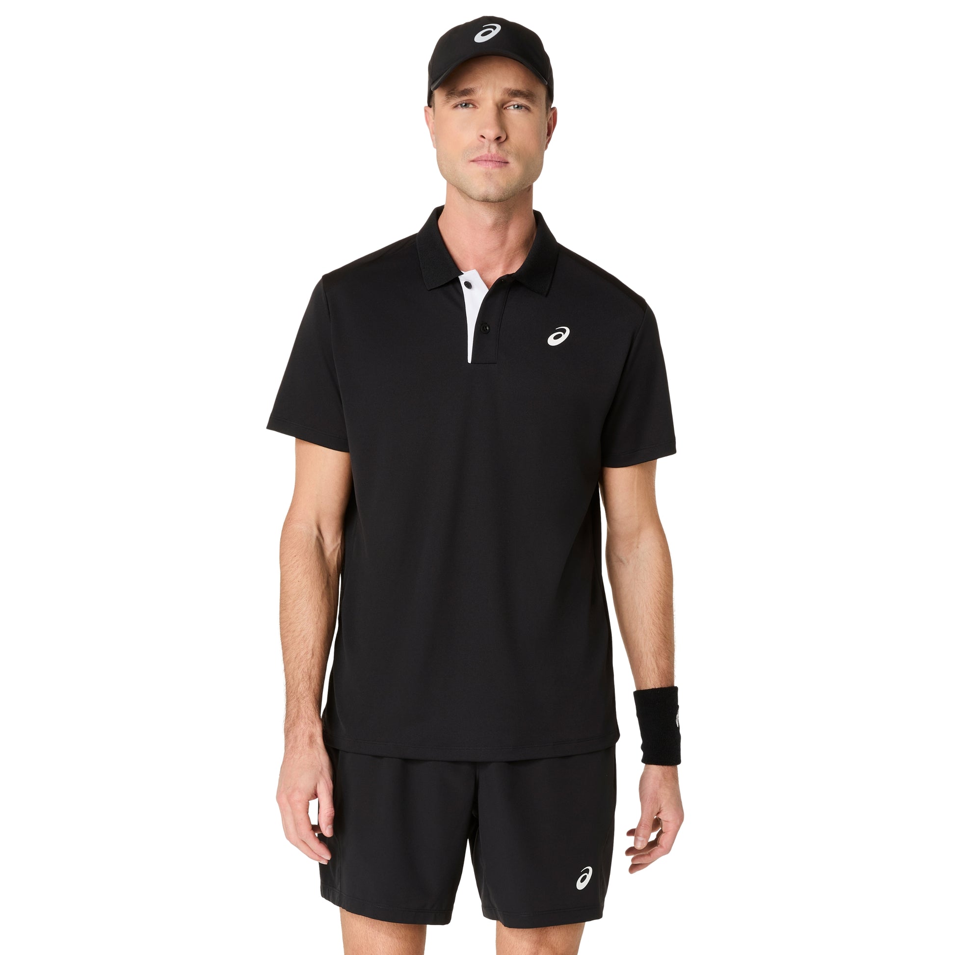 Man wearing a black polo shirt and shorts with a visible brand logo on a white background