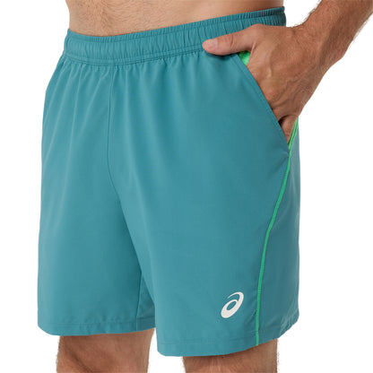 Teal athletic shorts with a logo on a white background