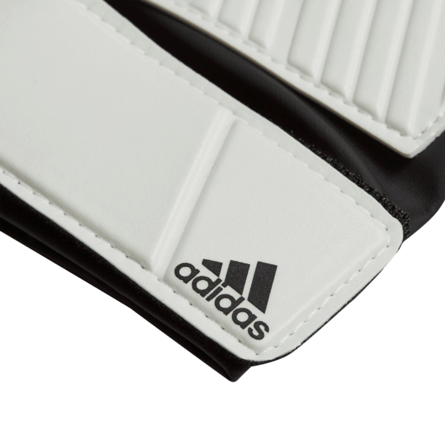 Close-up of Adidas logo on a white and black glove
