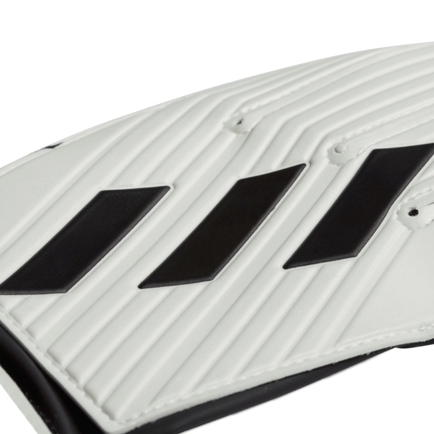 Close-up of a white and black adidas glove on a white background