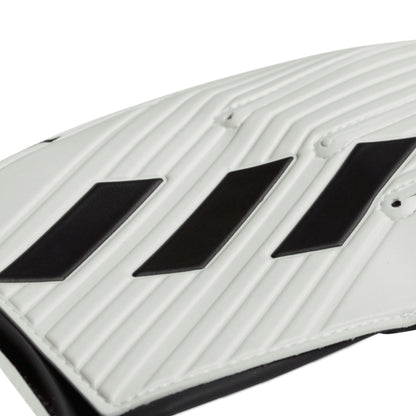 Close-up of a white and black adidas glove on a white background