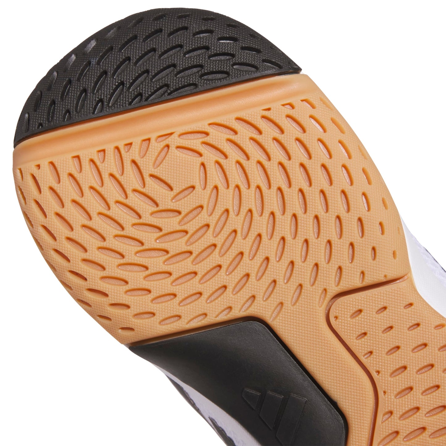 Close-up of a shoe sole with brown tread pattern on a white background