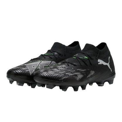 Black soccer Puma boots with Puma logo on a white background