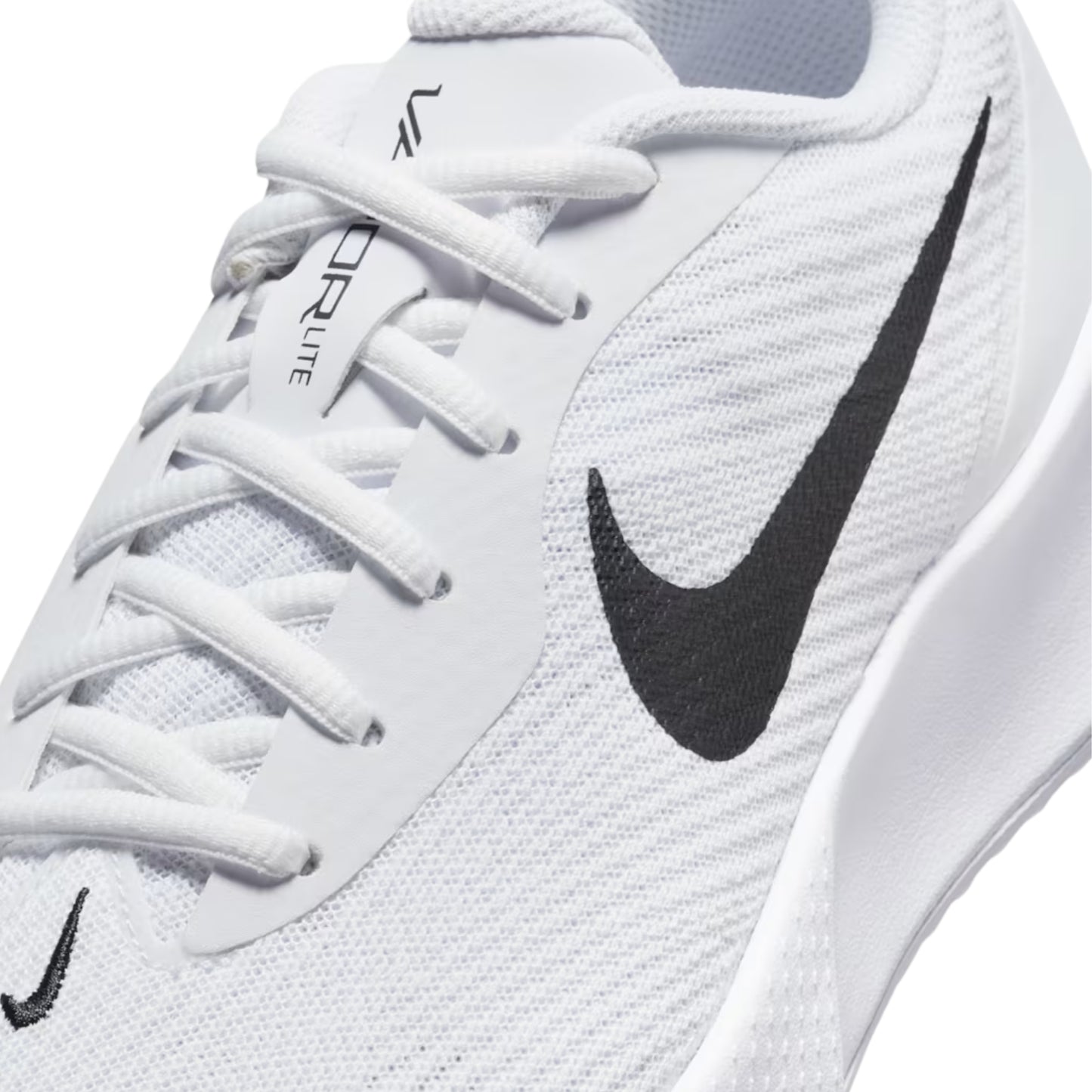White tennis shoe with black Nike logo on a white background
