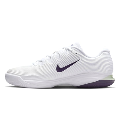 White tennis shoe with navy swoosh logo on a white background