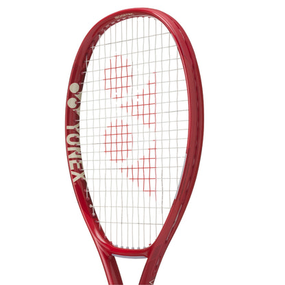 Red Yonex tennis racket on a white background