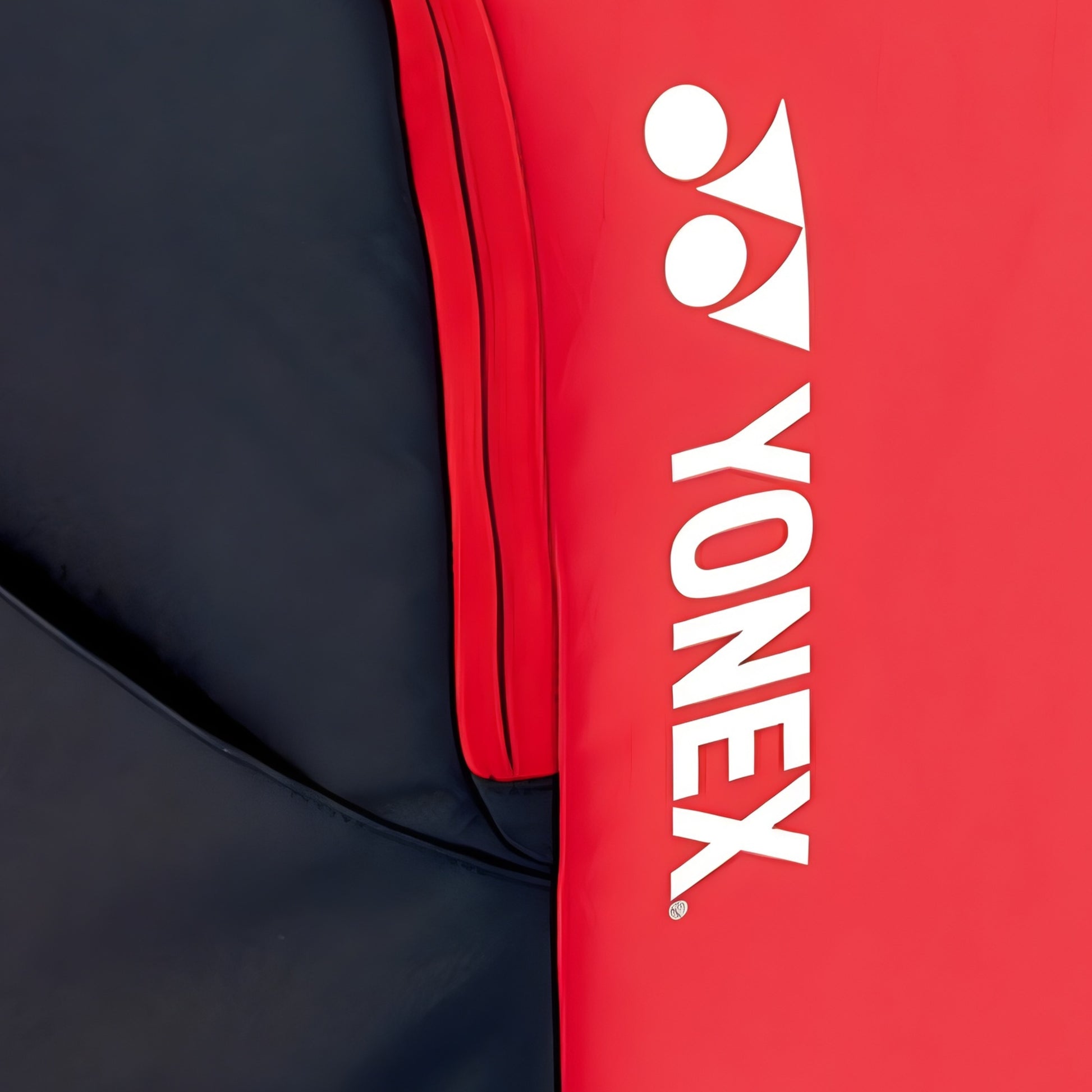 Close-up of a Yonex red and navy backpack 
