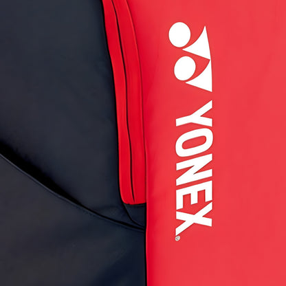 Close-up of a Yonex red and navy backpack 