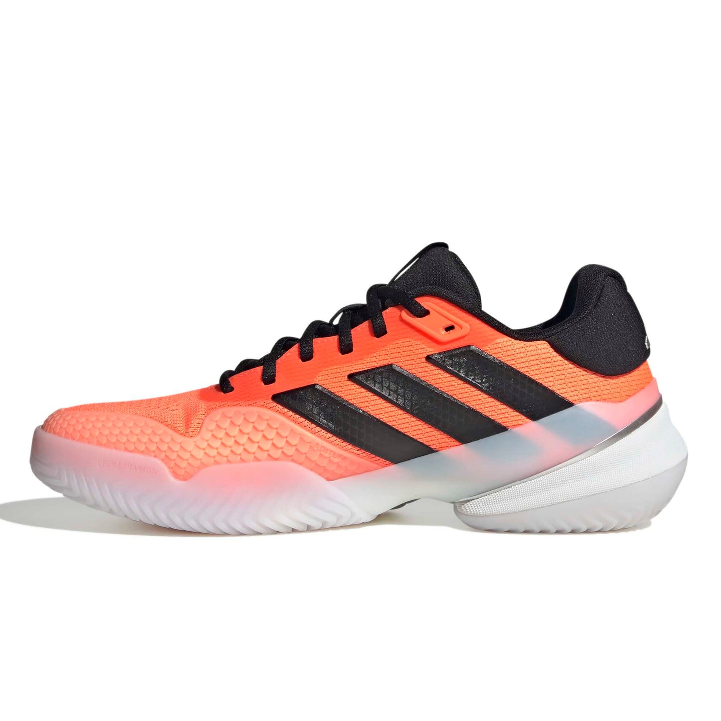 Orange and black Adidas tennis shoe on a white background