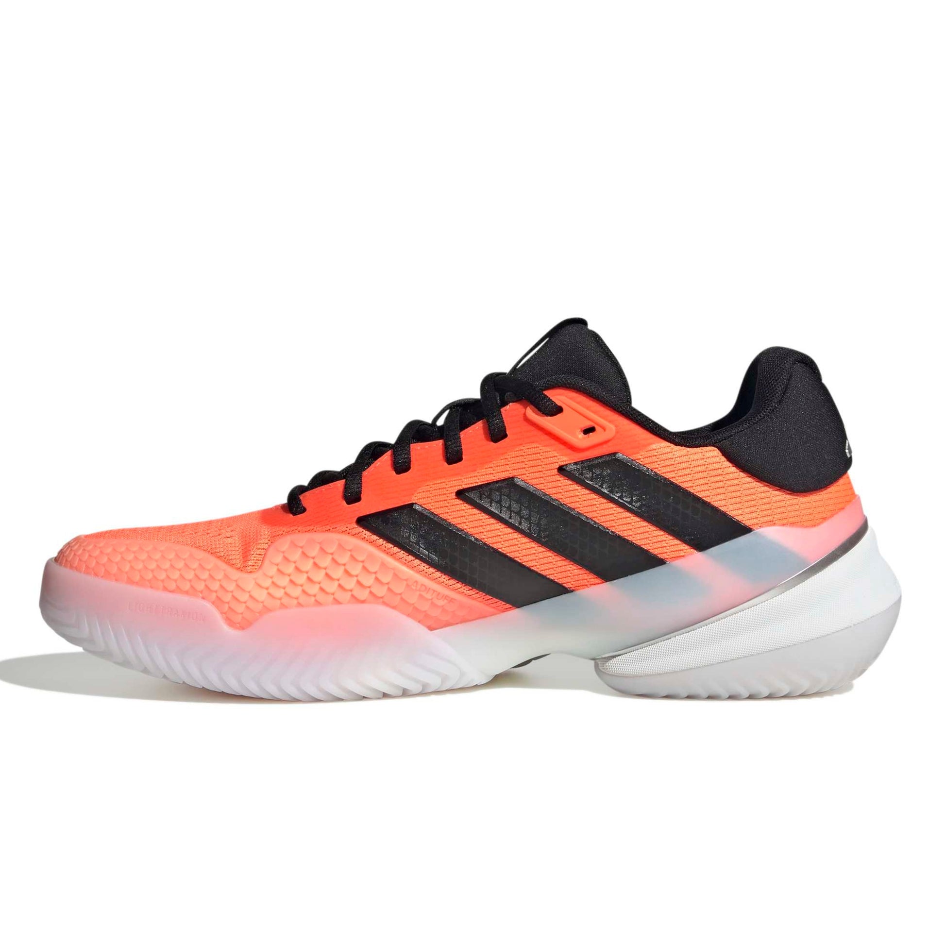 Orange and black Adidas tennis shoe on a white background