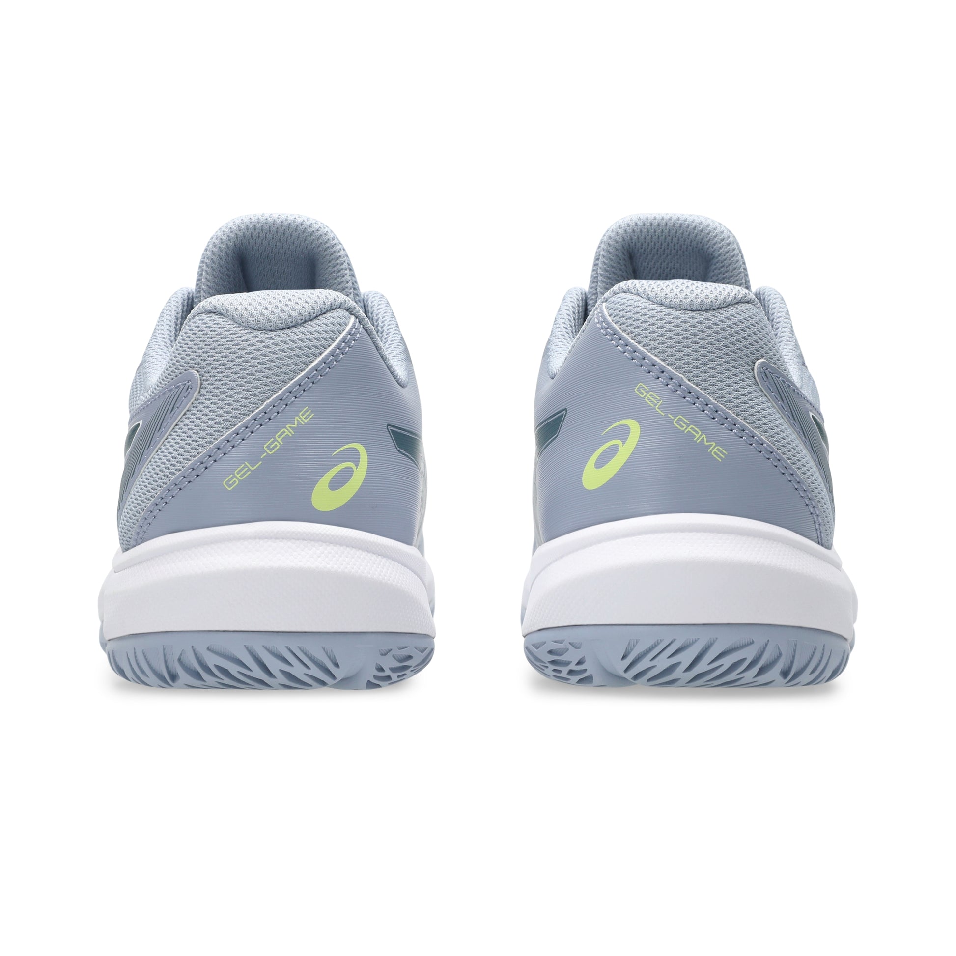 Pair of gray tennis kids shoes with green accents on a white background