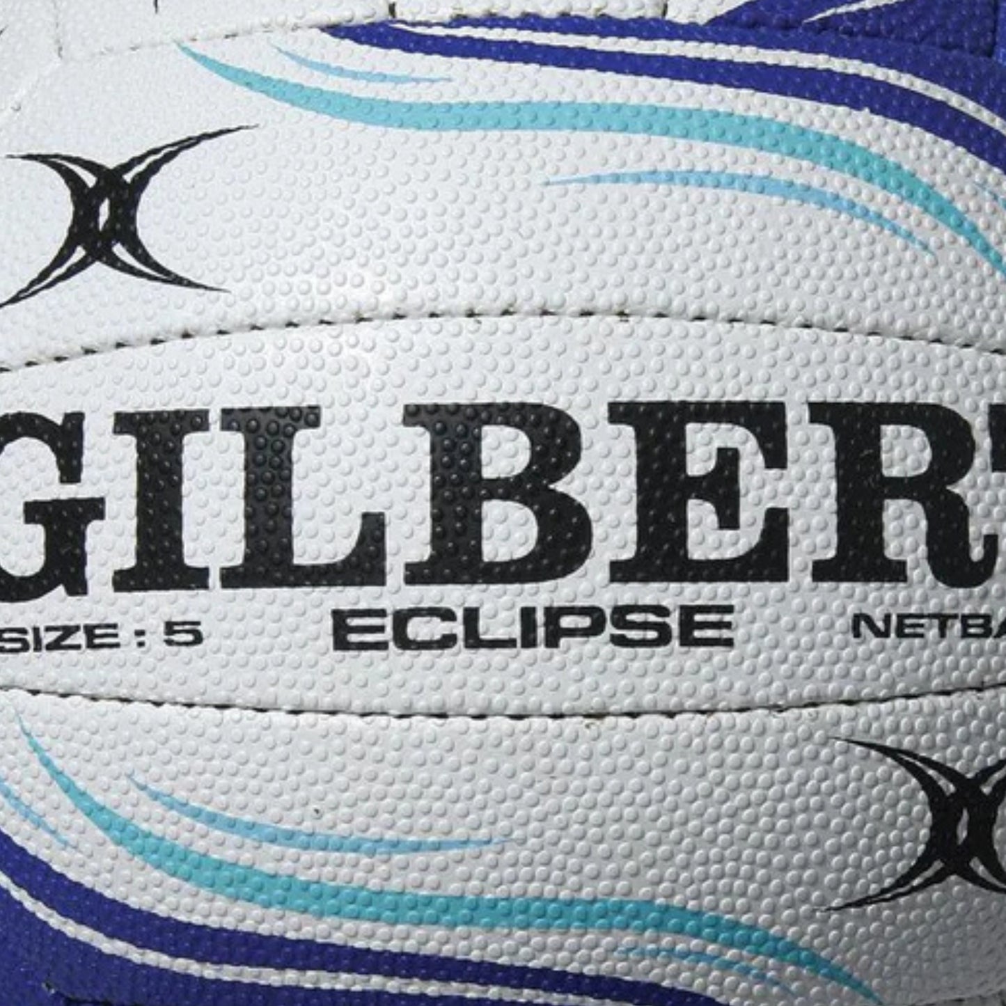 Close-up of a Gilbert Eclipse netball with branding and size information.