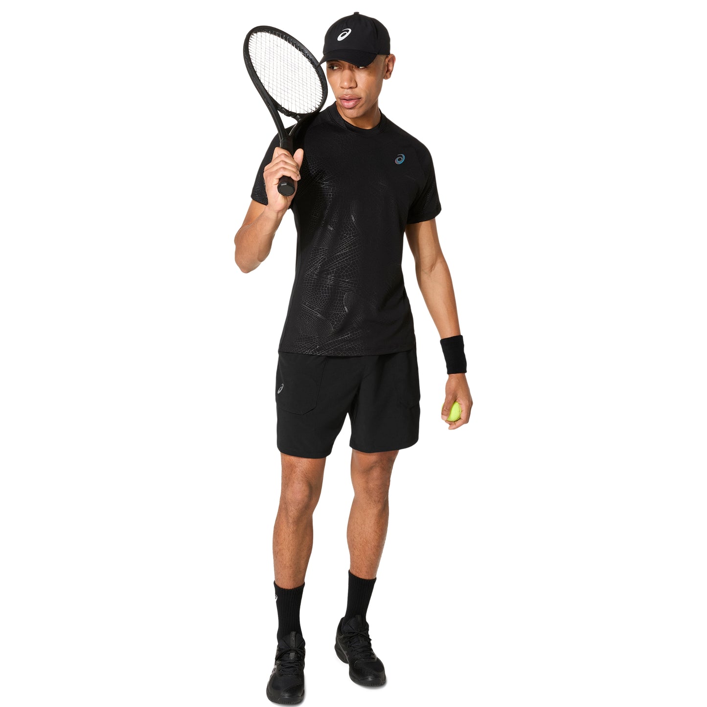 Man wearing a black tennis outfit with a racket and ball on a white background