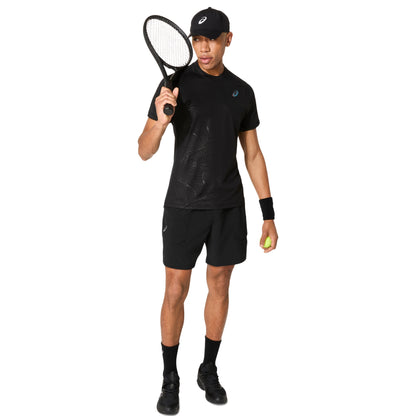Man wearing a black tennis outfit with a racket and ball on a white background