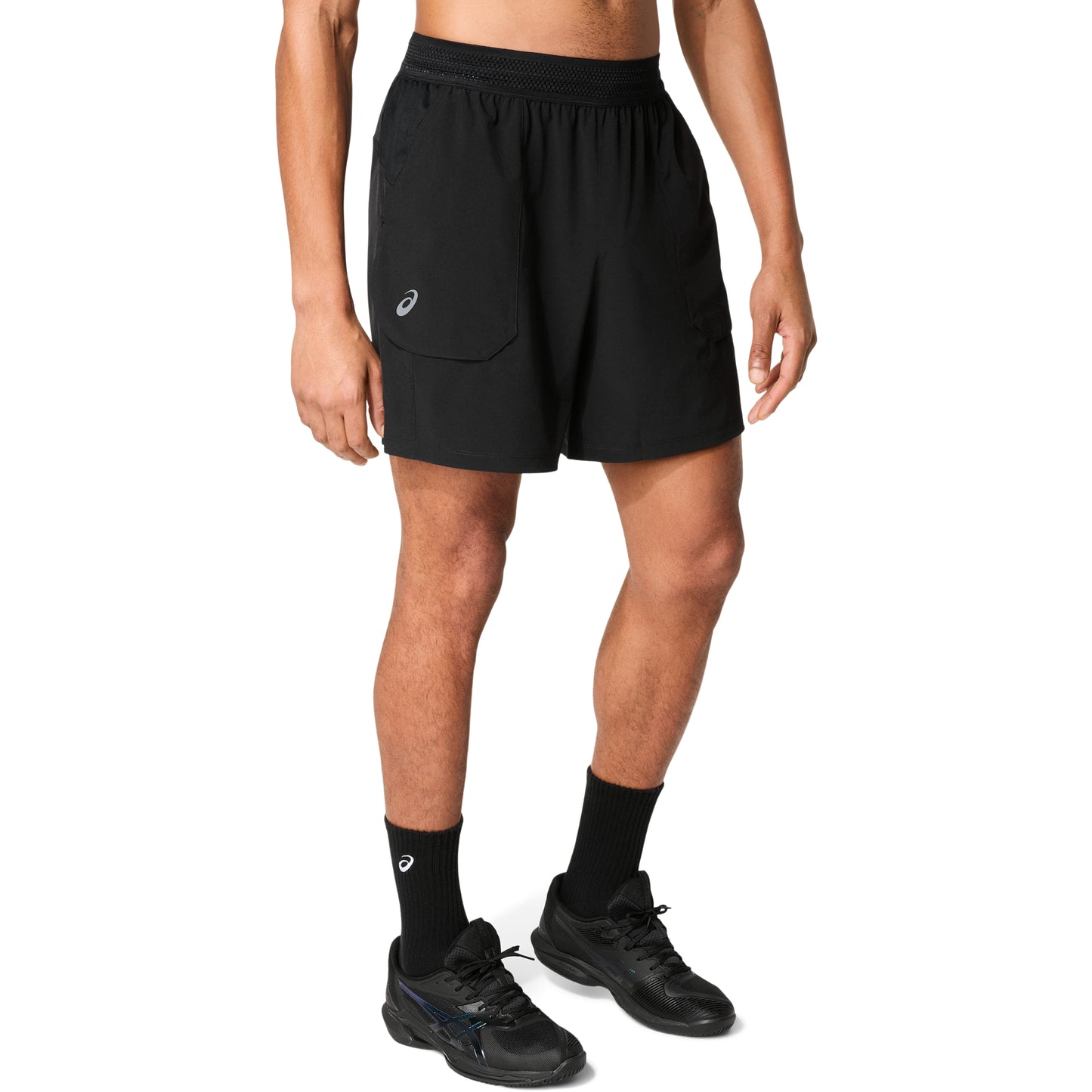 Man wearing black shorts on a white background