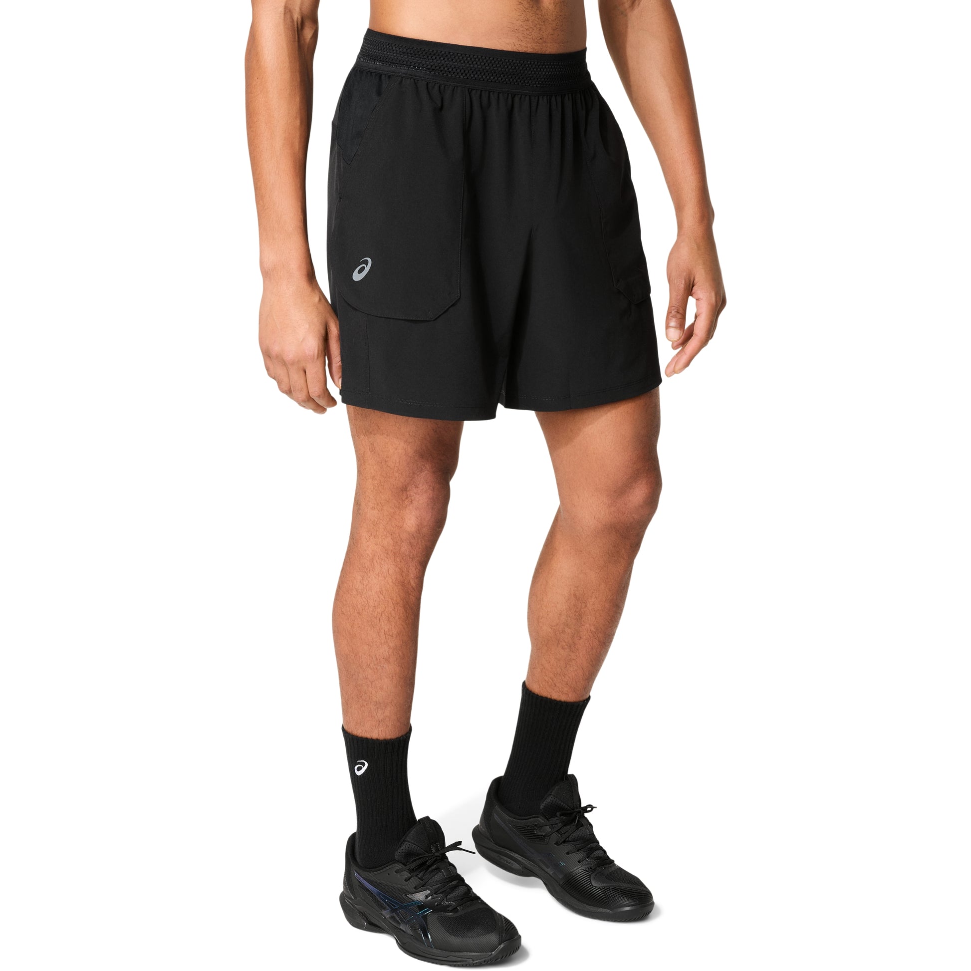 Man wearing black shorts on a white background