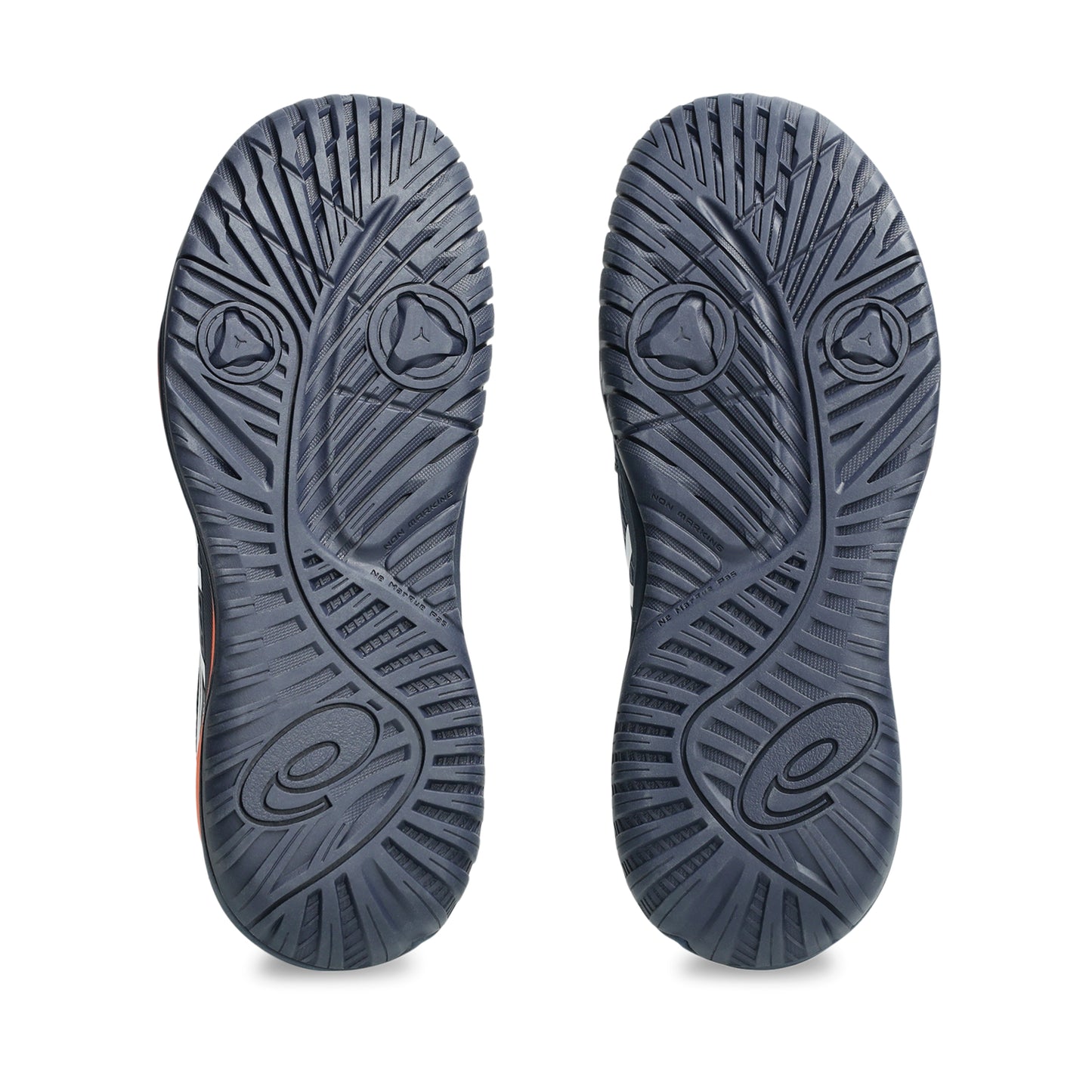Close-up of a pair of navy tennis shoes with tread pattern on a white background