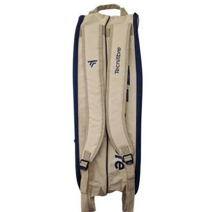 Beige and navy tennis bag with visible branding on a white background
