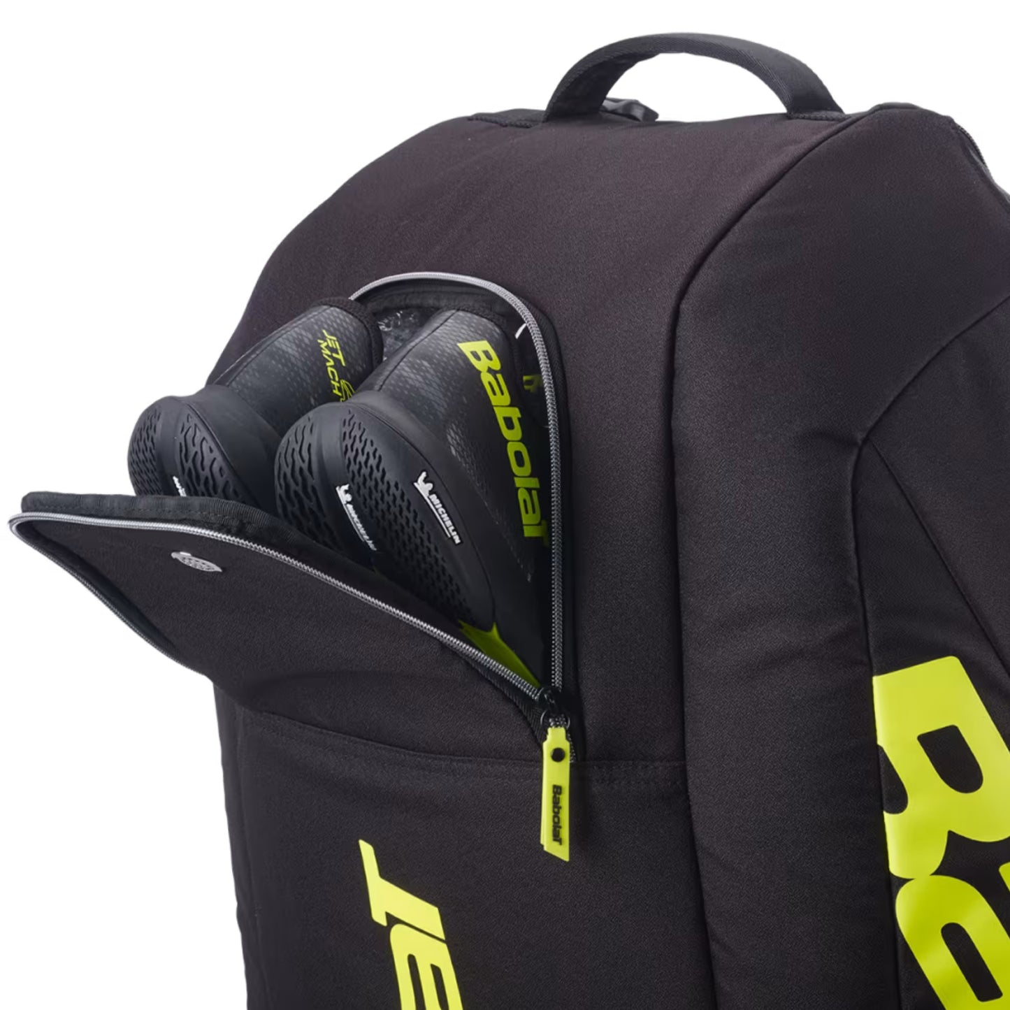 Black tennis bag with open compartment showing tennis rackets, featuring the Babolat logo.