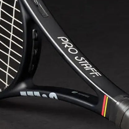 Close-up of a tennis racket with 'Pro Staff' branding on a dark background