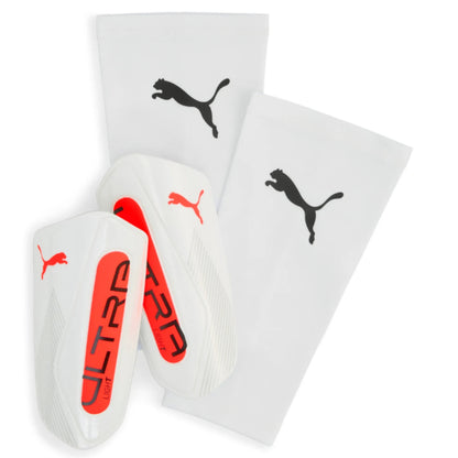 White shin guards with red accents and Puma logo on a white background
