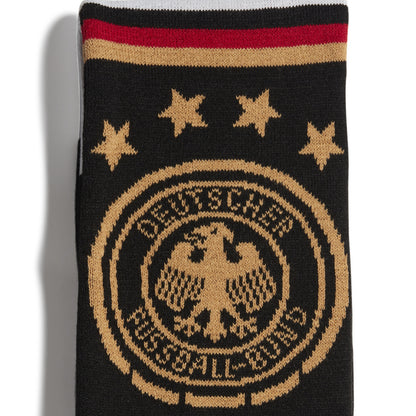 Black and gold scarf with star patterns and text on a white background