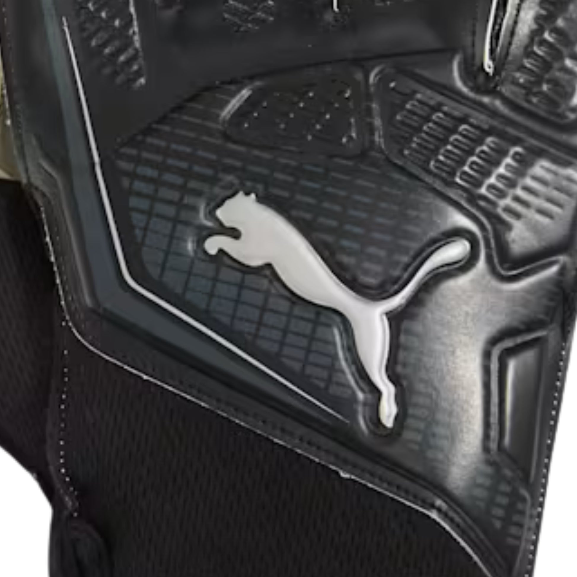 Close-up of a black sports glove with a prominent Puma logo.