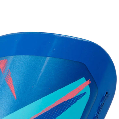 Close-up of a blue and pink geometric-patterned object on a white background