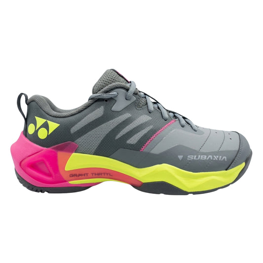 Gray Yonex squash shoe with pink and yellow sole on a white background