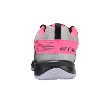 Back view of a Yonex athletic shoe with pink and gray design on a white background