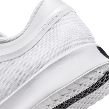 Close-up of a white tennis shoe with text on the side