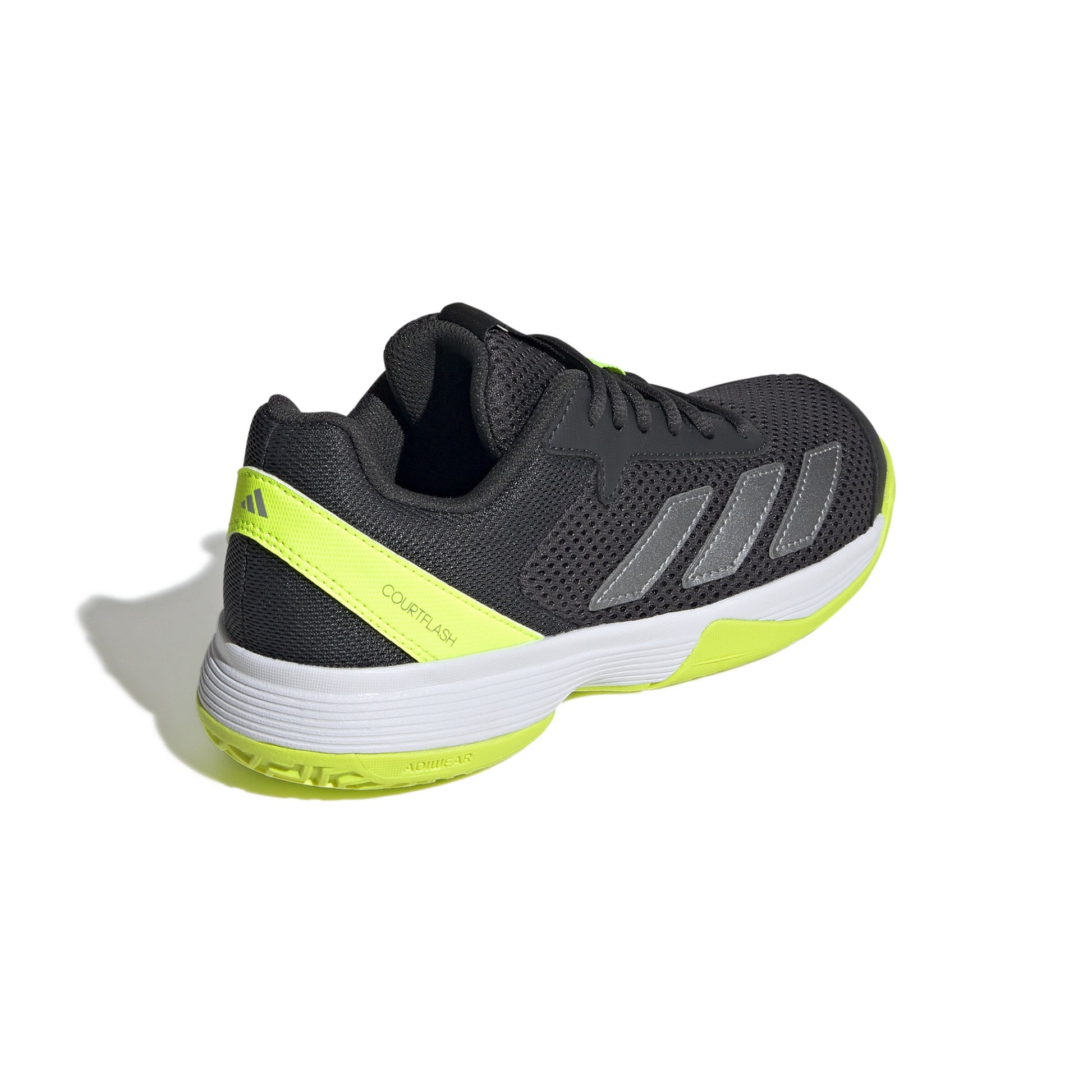 Black and yellow tennis shoe with Adidas logo on a white background